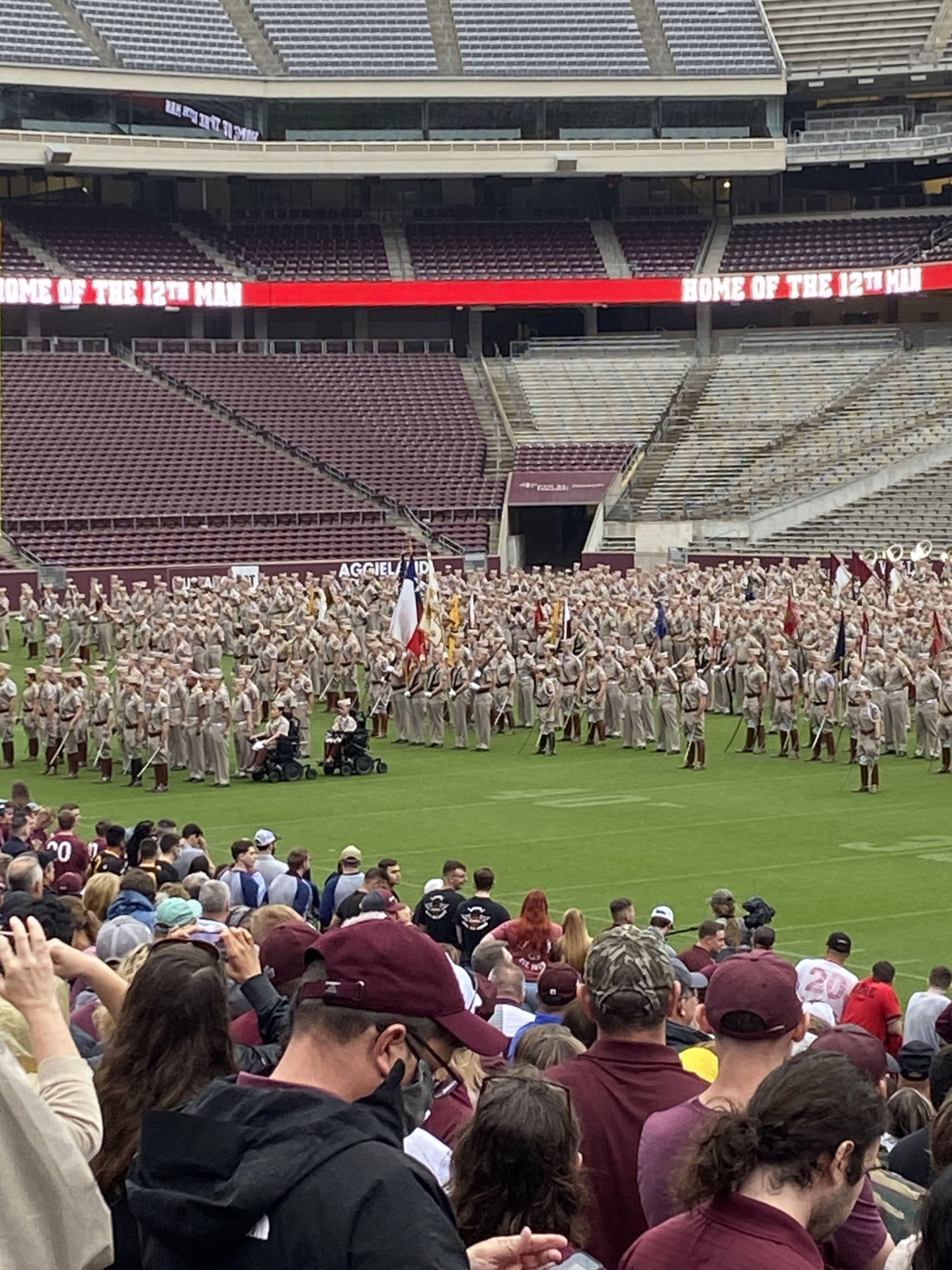 Ty and Taylor Sutton in formation with the Texas A&M Corps of Cadets on Kyle Field at Texas A&M University, College Station.