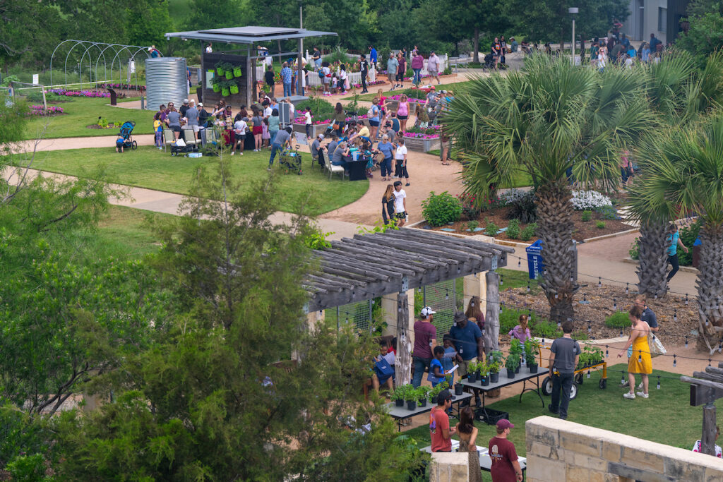 An aerial view of a crowd enjoying the day at the Leach Teaching Gardens.