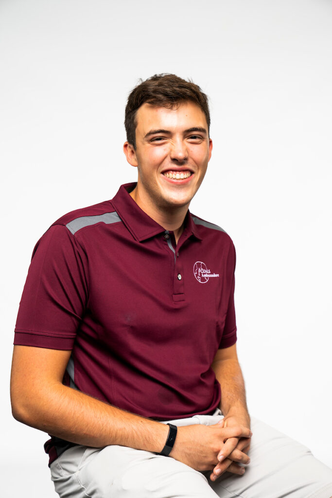Brown-Rudder Award recipient Christopher Barron - smiling male student in maroon Texas A&M logoed shirt