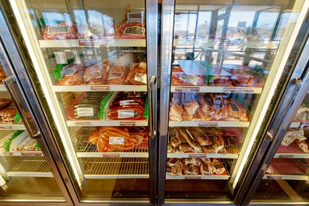 A meat fridge at the Texas A&M Rosenthal Meat Center that is filled with various types and cuts of meat. 