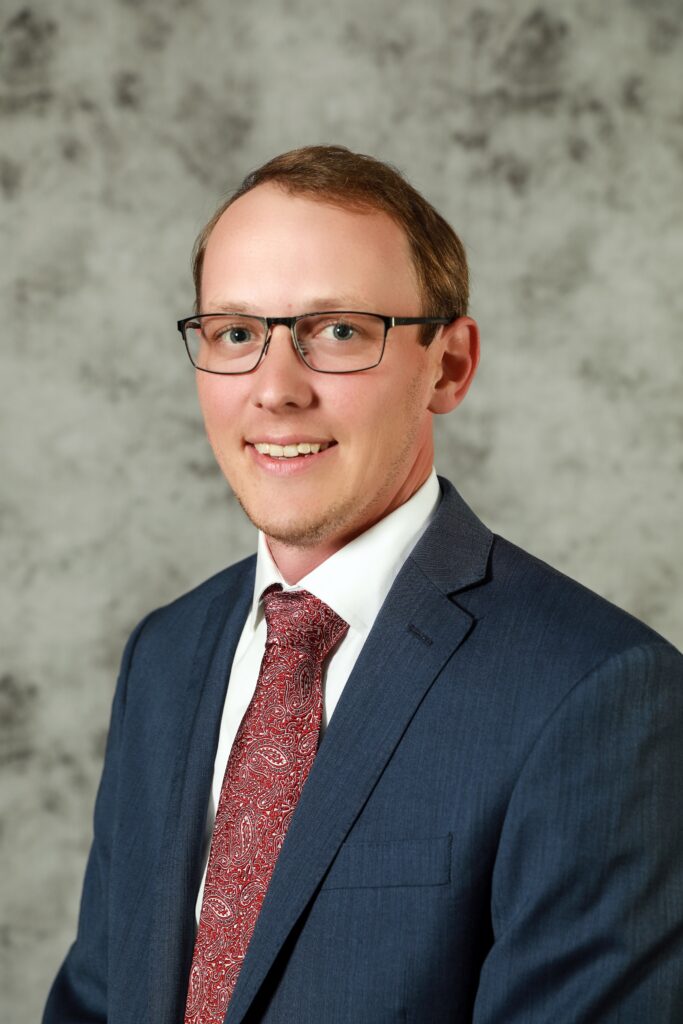 a man in glasses and a suit and tie, Ky Pohler, Department of Animal Science researchers and associate professor