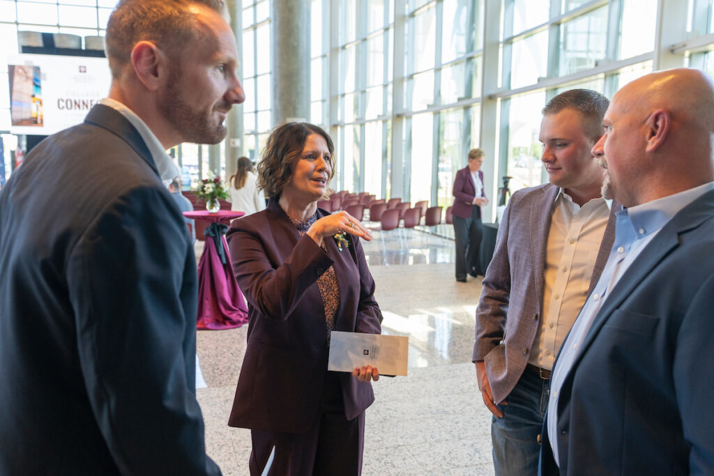 people gathered in a large foyer at the College Connect awards event